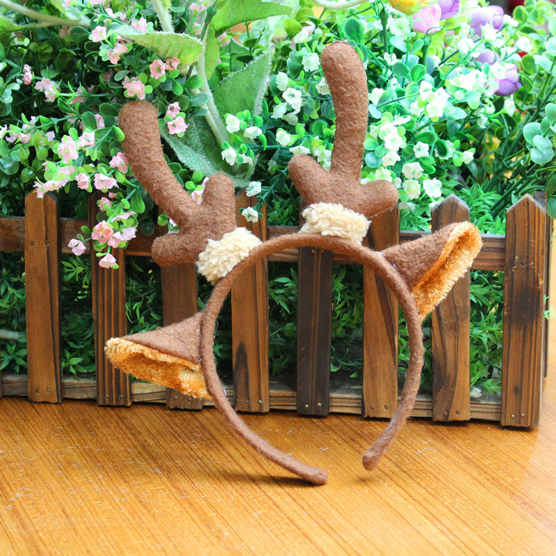 Colorful Christmas headbands including giraffe and deer designs for holiday fun