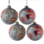 Glass Christmas ball ornaments set displayed on holiday tree branches