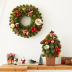 Nobesone Christmas wreath with festive design hanging on a door
