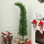 Whimsical pencil Christmas tree with curled top standing in living room