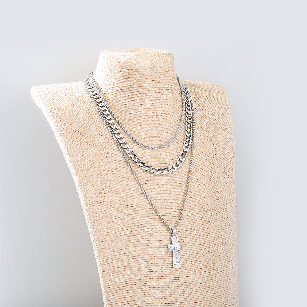 Stacked crosses necklace representing layered faith symbolism