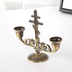 Cross candle holder ornament styled on a home altar with religious accents