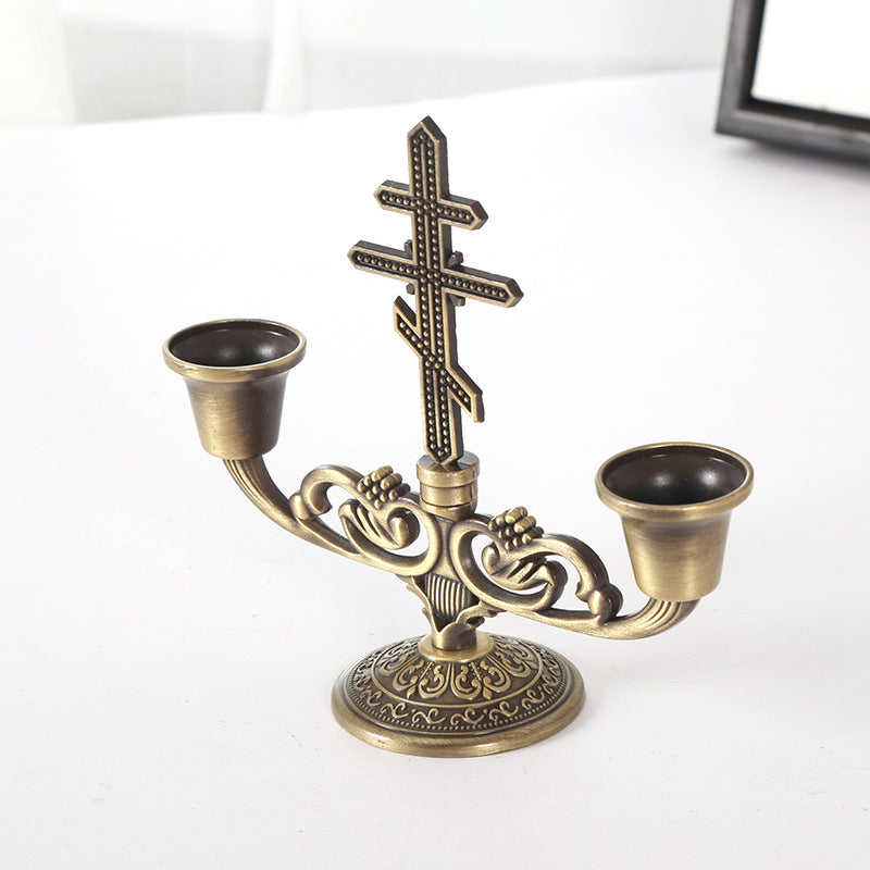 Faith-inspired candle holder with classic cross silhouette
