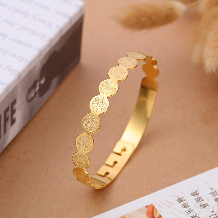 Adjustable gold-tone scripture bracelet laid flat showing dimensions