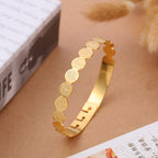 Adjustable gold-tone scripture bracelet laid flat showing dimensions