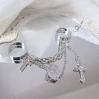 Vintage cross ring worn on two fingers for a stacked look