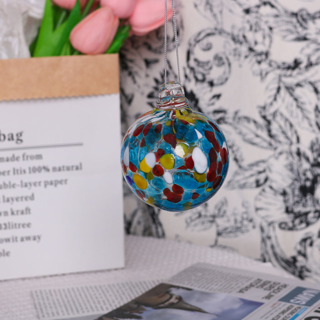 Close-up of hand-crafted transparent glass Christmas ornament surface detail