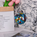 Close-up of hand-crafted transparent glass Christmas ornament surface detail