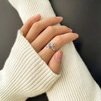 Close-up view of electroplated cross and Jesus design on adjustable ring