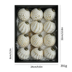 Antique gold, silver, green, and black Christmas balls displayed together