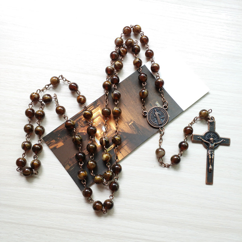 Vintage imitation agate benedict cross necklace with metal chain on dark background faith jewelry Main image
