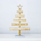 Gray painted letter ornament on Christmas tree