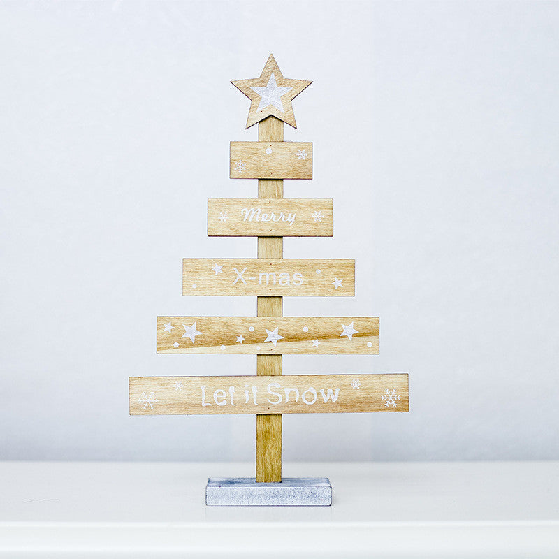 Gray painted letter ornament on Christmas tree
