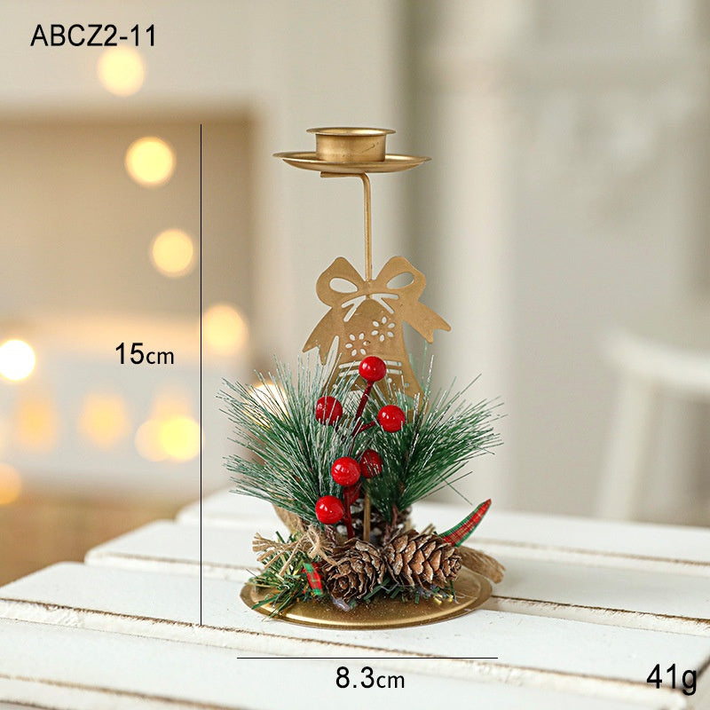 Set of golden Christmas candlesticks for window display