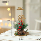 Set of golden Christmas candlesticks for window display