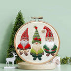 Completed Christmas embroidery designs on rustic table setting