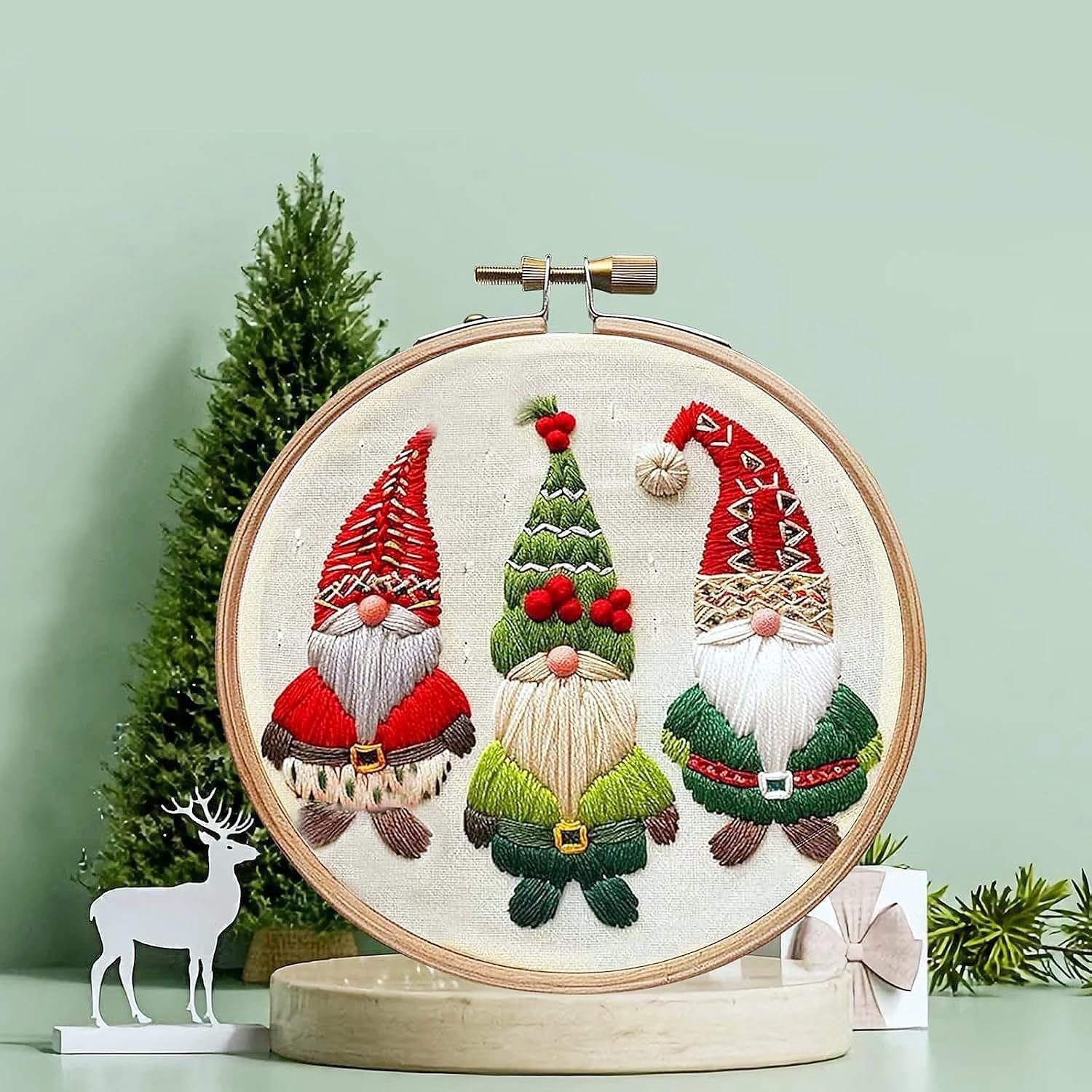 Completed Christmas embroidery designs on rustic table setting