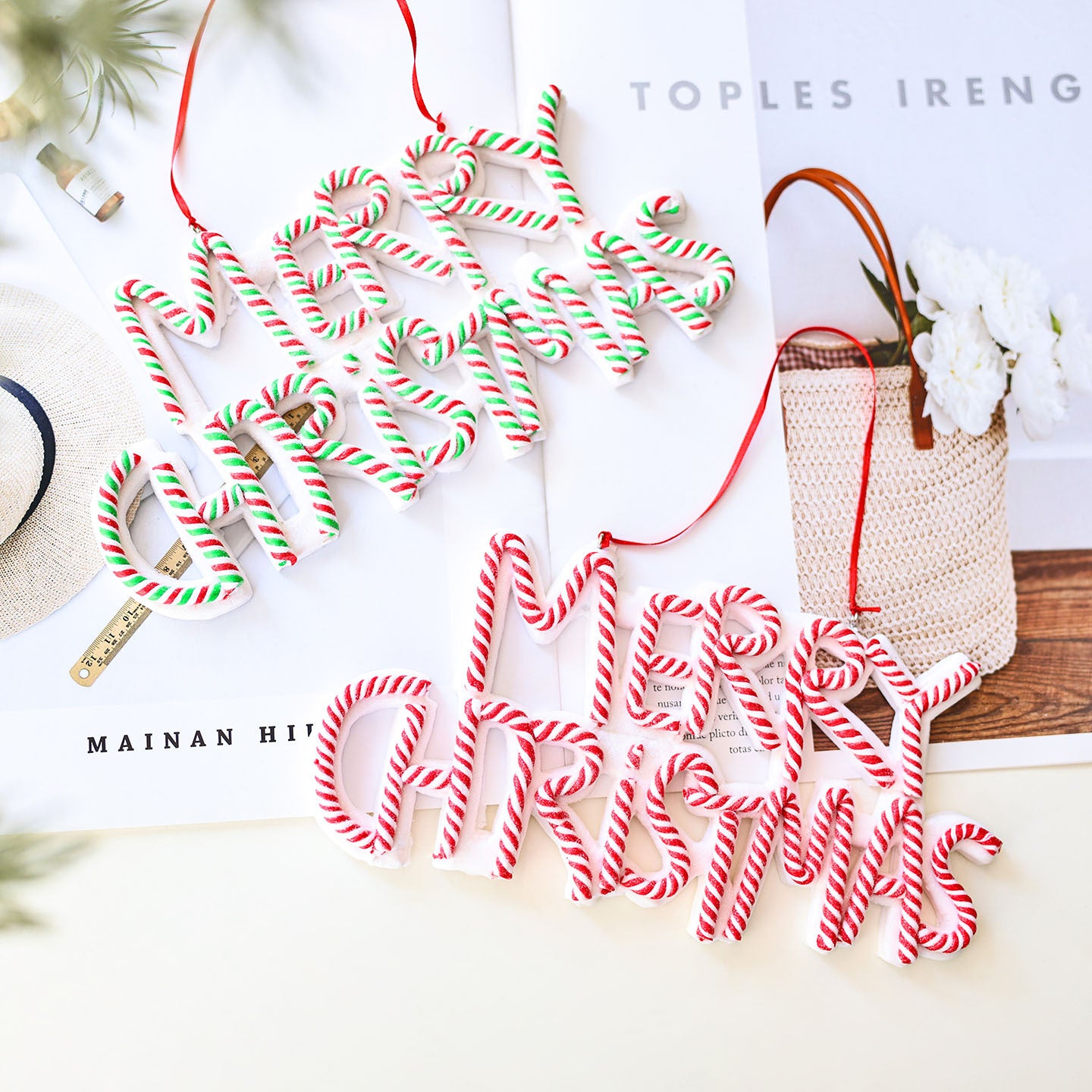 Merry Christmas word plate ornament hanging on Christmas tree