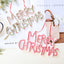 Merry Christmas word plate ornament hanging on Christmas tree