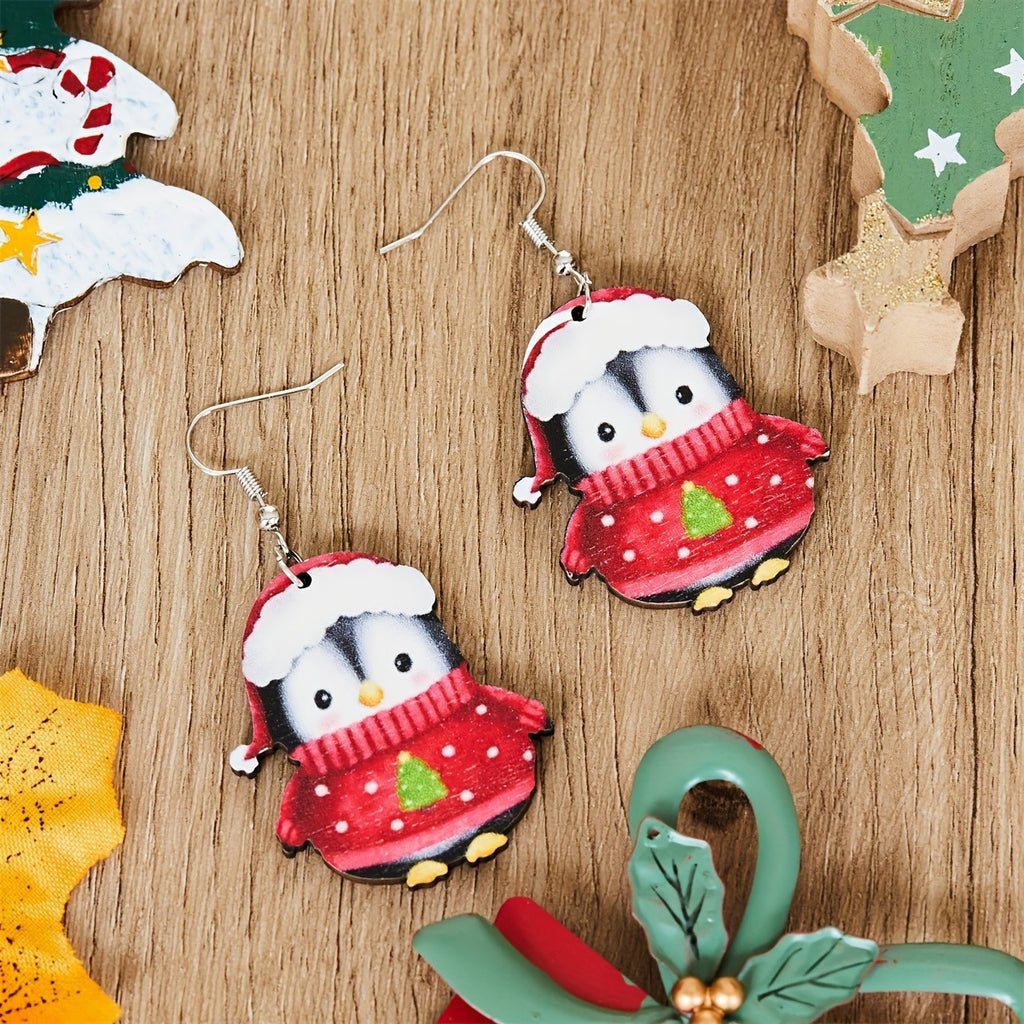 Set of two cartoon penguin earrings celebrating the Christmas season