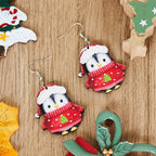 Set of two cartoon penguin earrings celebrating the Christmas season