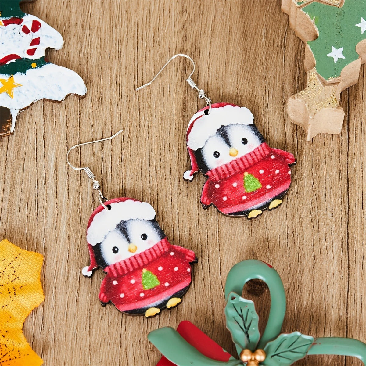 Set of two cartoon penguin earrings celebrating the Christmas season