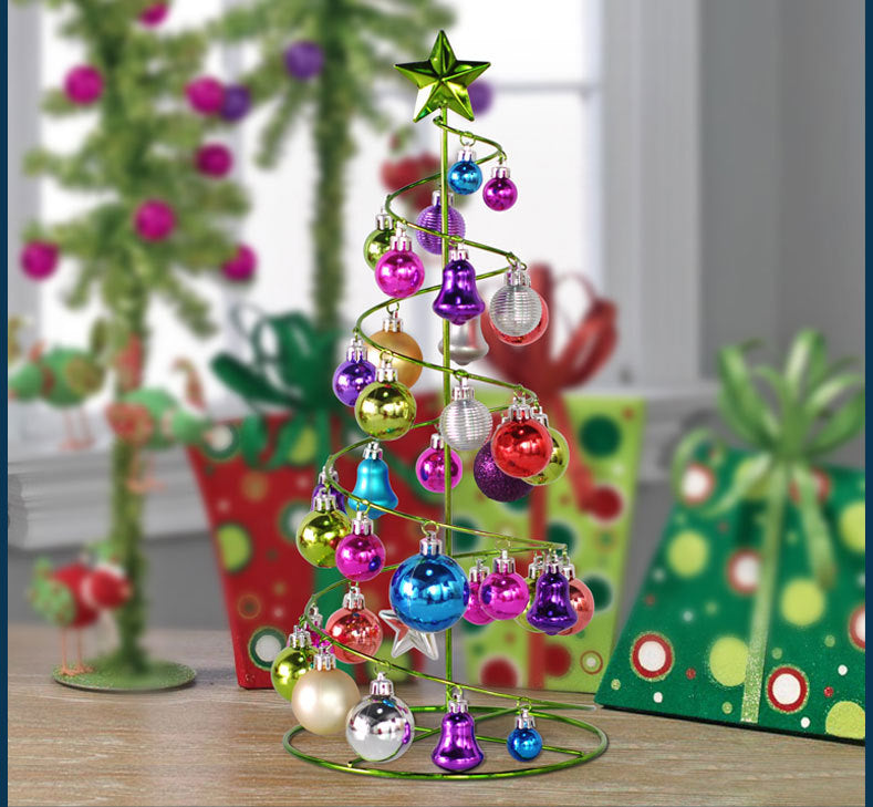 Metal mini tree with Christmas ornaments and greenery
