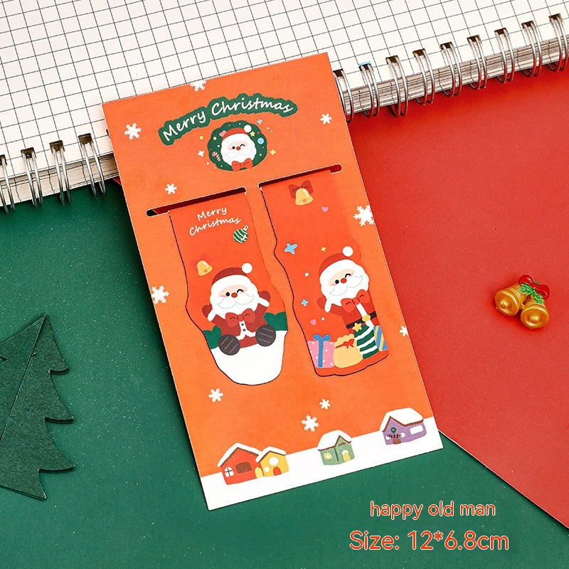 Set of four Christmas magnetic bookmarks displayed together