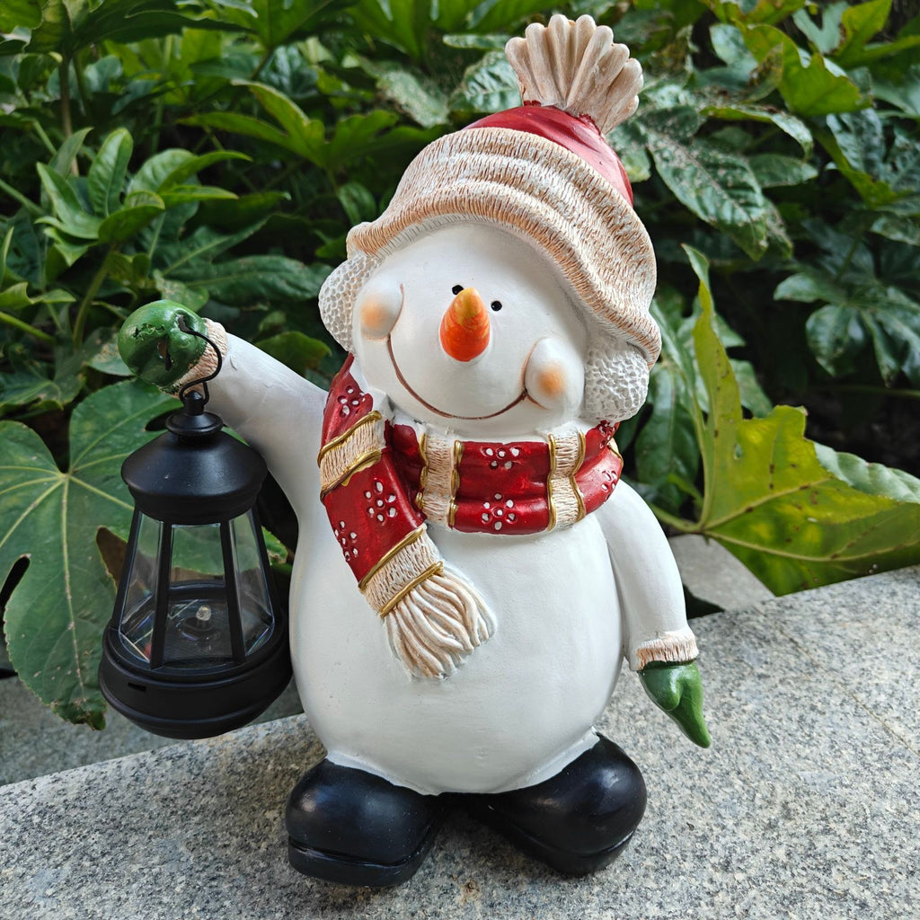Holiday landscape lamp with elf and snowman figures