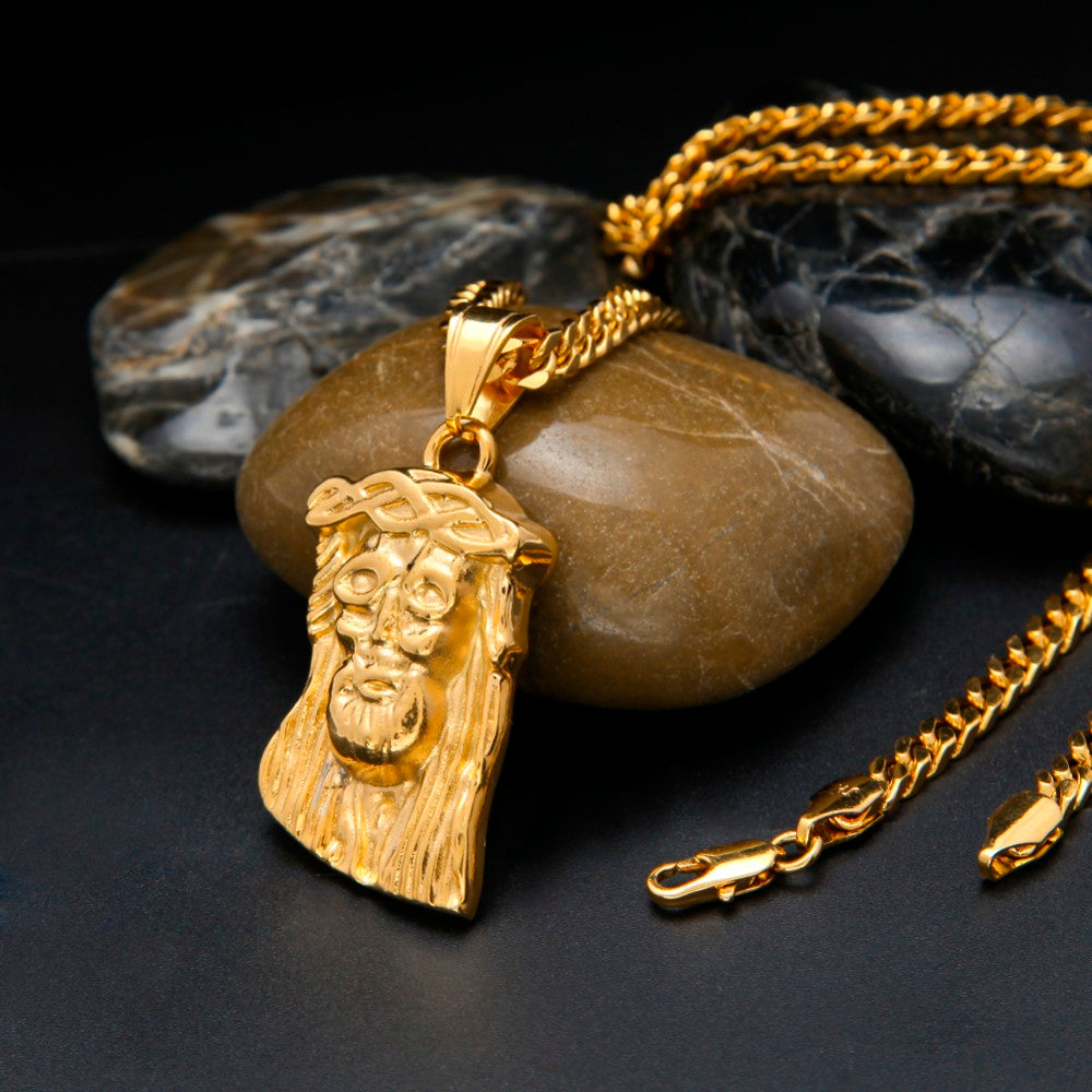 Jesus pendant displayed against neutral background
