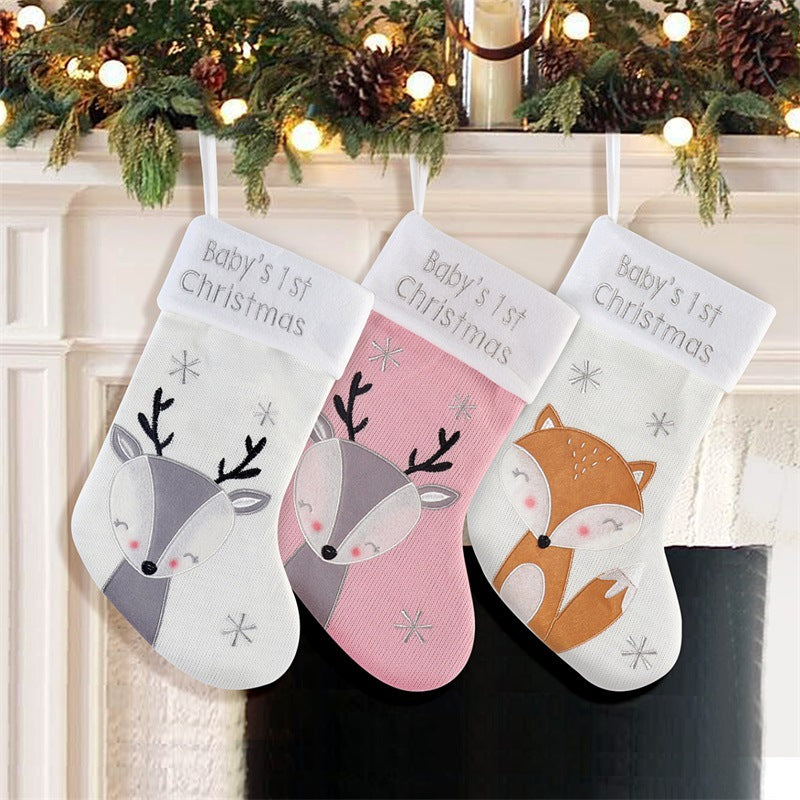 White fox Christmas stocking hanging by fireplace for holiday celebrations