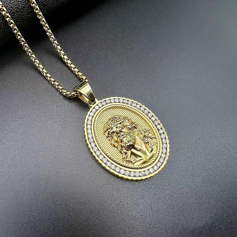 Polished geometric Jesus pendant detail on gold-plated chain