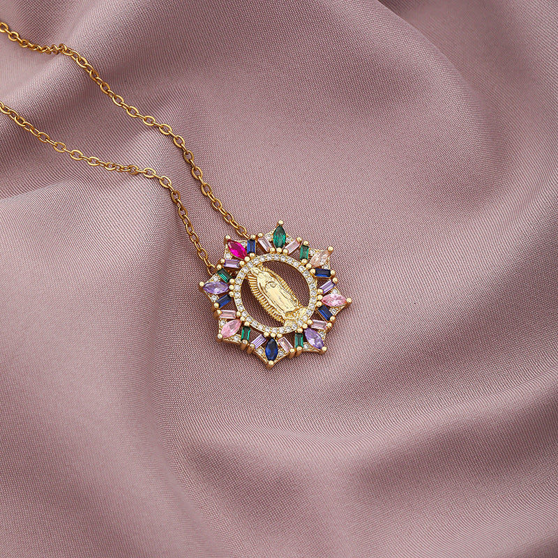Five Virgin Mary necklace design variants displayed together on display stand