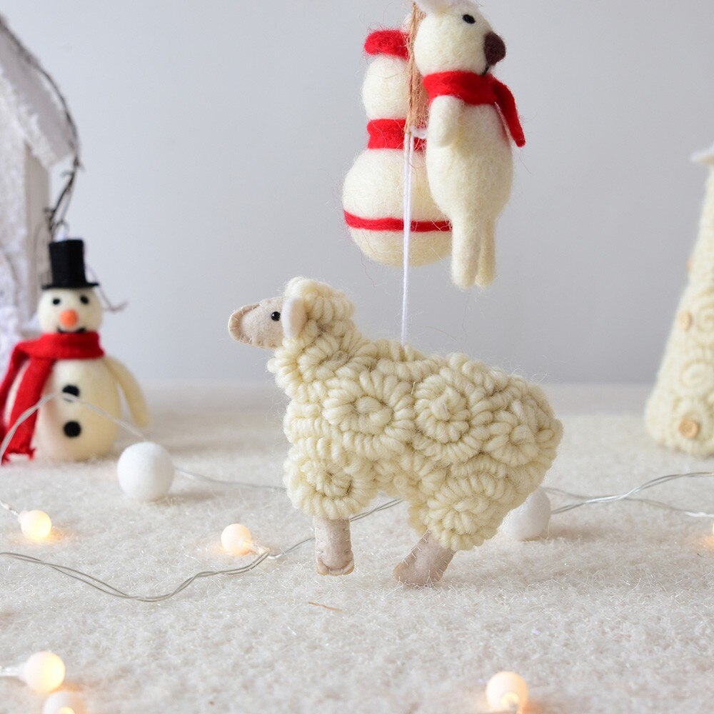 Little wool felt sheep Christmas hanging ornament displayed decoratively Main image