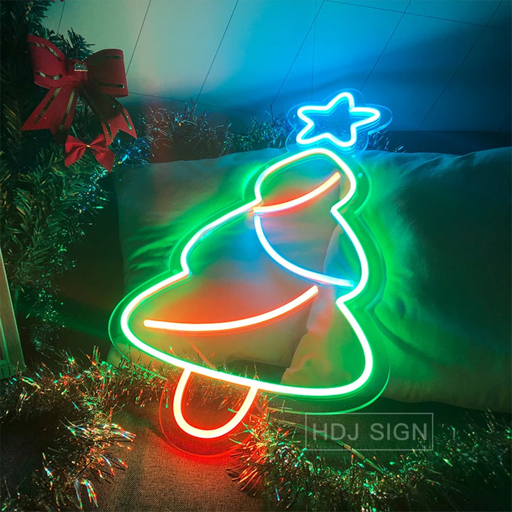 Christmas tree neon sign against dark background showing luminous glow effect