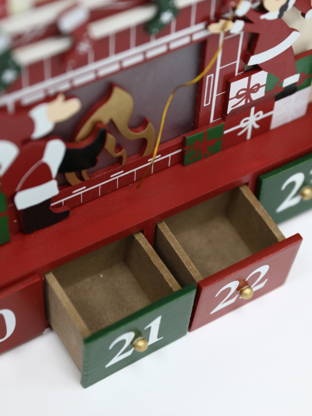 Christmas wooden countdown calendar box displayed as festive home decor on wooden surface