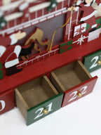 Christmas wooden countdown calendar box displayed as festive home decor on wooden surface