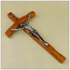 Elegant wall cross combining natural wood grain with metal detailing