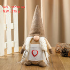 Side view of a cloth faceless doll ornament for holiday home decor