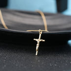 Faith-inspired gold cross necklace display