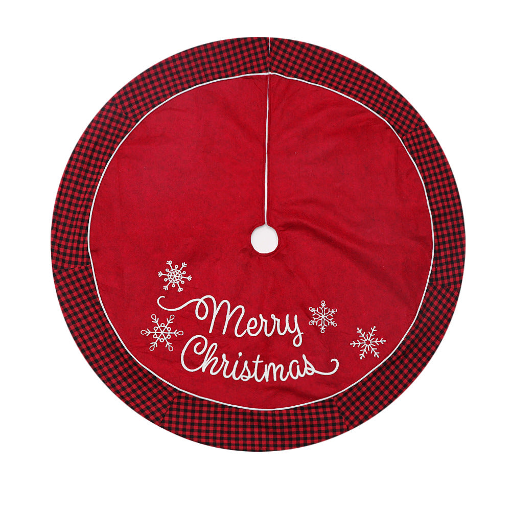 Black and red plaid Christmas tree skirt with classic edging around the tree base for festive holiday display