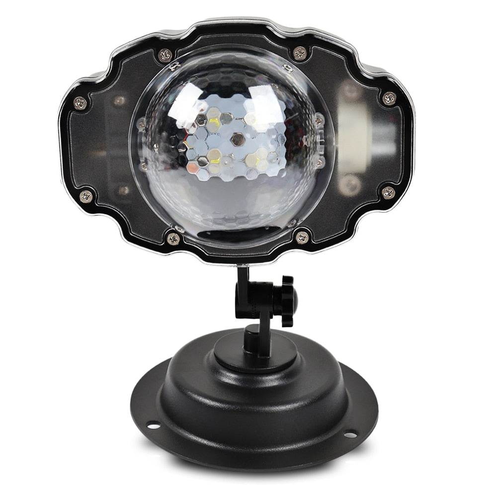 LED Snowfall Christmas Projector Light with ground stake installation in yard