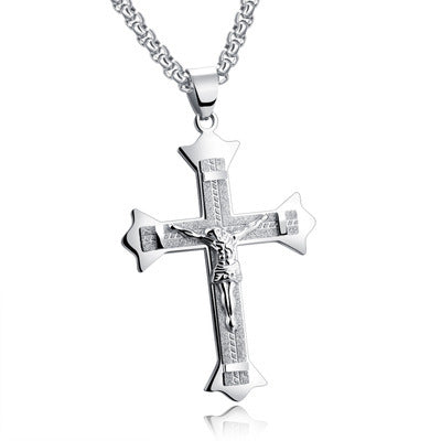 Close-up view of stainless steel cross pendant detailing