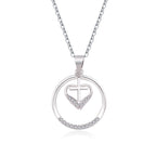 Silver heart cross pendant displayed on chain against soft background