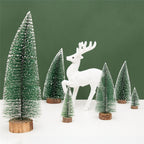 Green and white pine needle tree decoration displayed on wooden surface