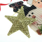 Two plastic star ornaments in gold and silver finish against festive red background