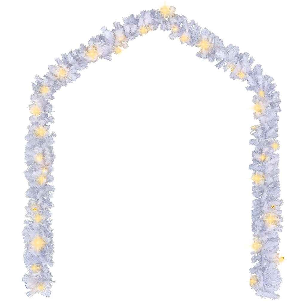 White garland draped along outdoor garden fence with LED glow