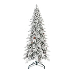 Flocked Christmas tree with warm lighting in home interior