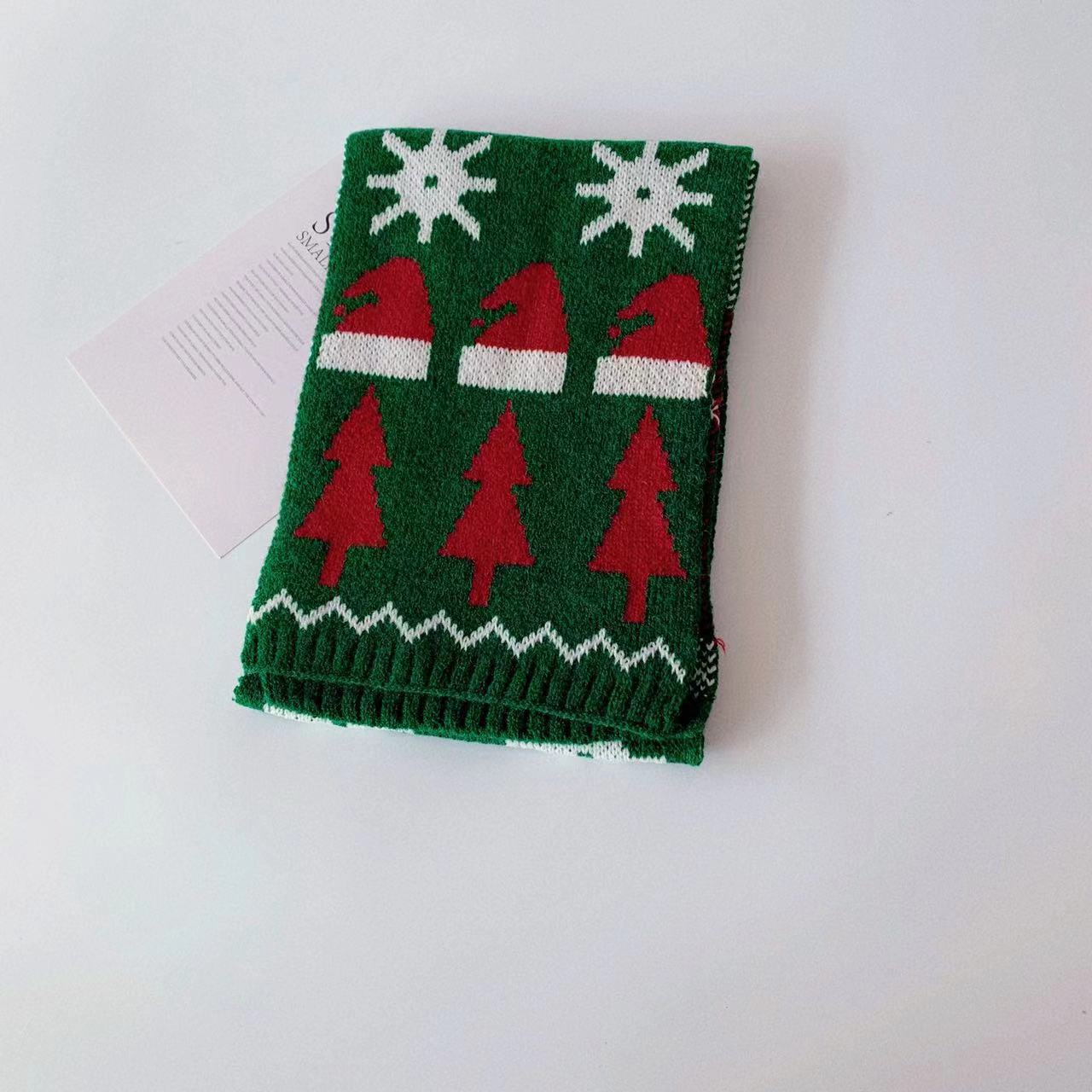 Soft acrylic children's scarf adorned with cheerful Christmas embroidery details