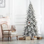 Snow-covered 7.5ft flocked Christmas tree with natural pine cones